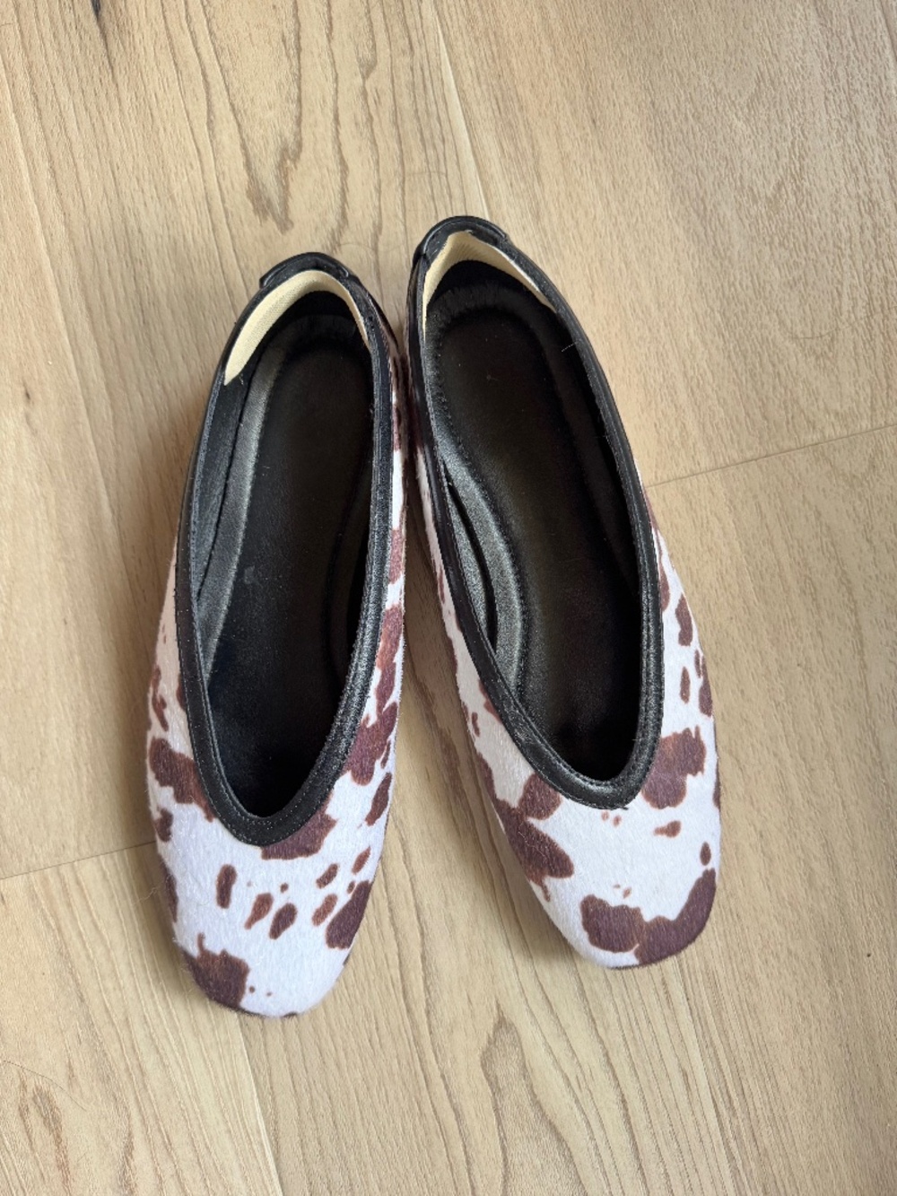 Cow print high vamp flats